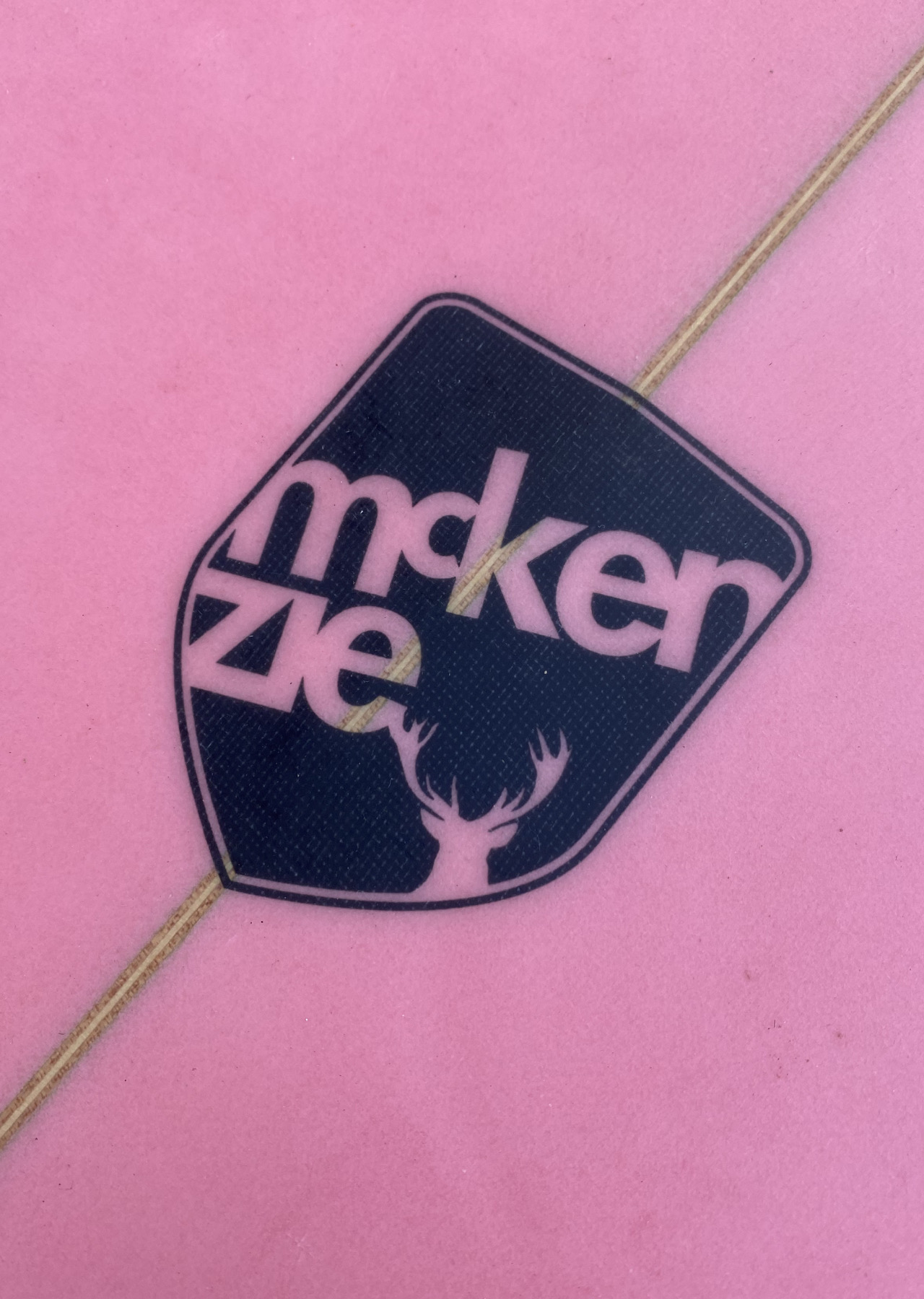 Shield logo on a surfboard